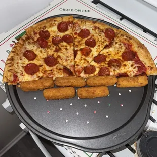 half of my pepperoni pizza with my order of Mozzarella Sticks (6 pcs). i personally like to warm mine up in the oven for about 5 minutes