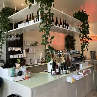 a bar with bottles of wine