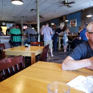 a man sitting at a table with a glass of water in front of him