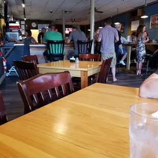 a person sitting at a table with a face mask on