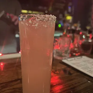 a close up of a drink in a tall glass