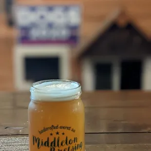 a jar of beer on a table