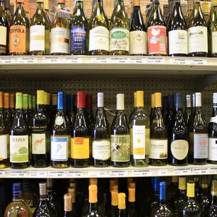 a shelf of wine bottles