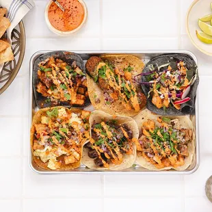 a tray of tacos and chips