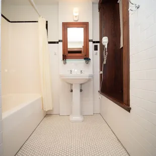 White tile bathrooms.