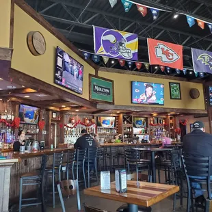 people sitting at the bar