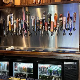 a row of beer taps