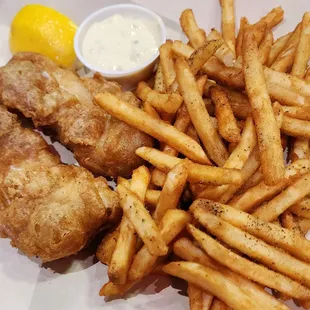 My fish and chips with tartar and lemon, perfectly seasoned fries.