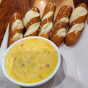 The queso gir the pretzel sticks.