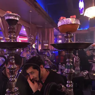 a man smoking a hooket