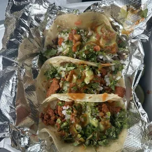 One carne asada taco, and two Al pastor tacos.