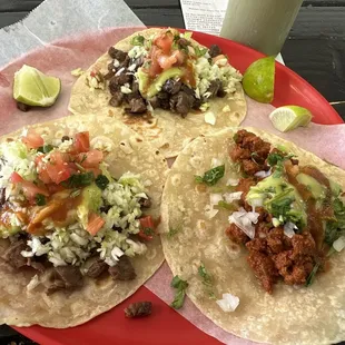 Carne asada and one al pastor.  Bomb dot gov.  Not your typical street tacos but still VERY bueno.  Fat bastard stamp of over approval.