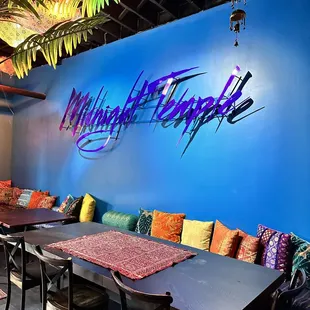 a restaurant with a blue wall