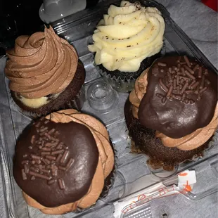chocolate cupcakes with frosting and sprinkles