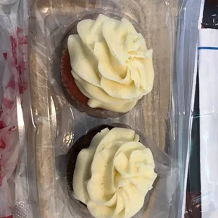 Strawberry and carrot cake cupcake both with vanilla icing