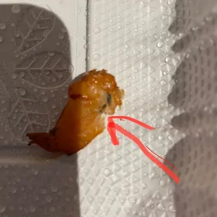 Shrimp from the fried rice. The black line is the vein which should have been taken off not left on.