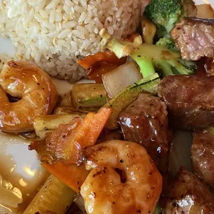 Steak and shrimp, hibachi with fried rice and vegetables.