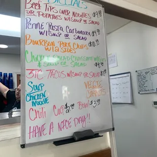 a menu on a white board