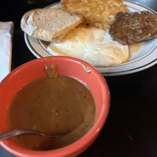 Basic Plus - two eggs over easy, hashbrowns, sausage, toast, and a side of red gravy