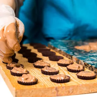 a person making chocolates