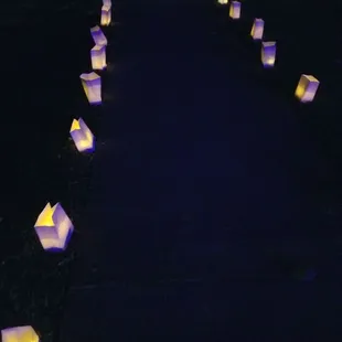 Cool path lighting...wanna know a secret? I think it&apos;s citronella candles to help ward off the mosquitoes.