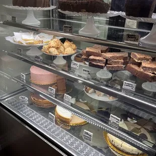 a display case with a variety of pastries