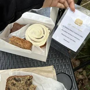 Caramel banana bread, cinnamon roll, amish loaf, chocolate brownie with walnuts