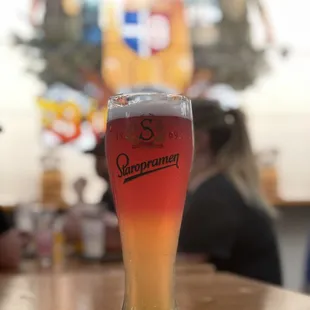 a glass of beer on a table
