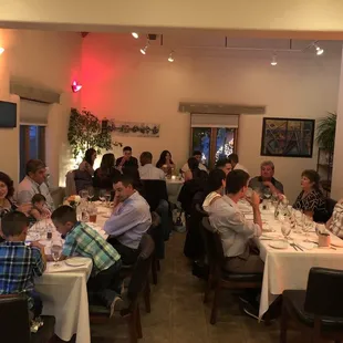 a large group of people sitting at tables