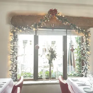 a dining room with christmas decorations