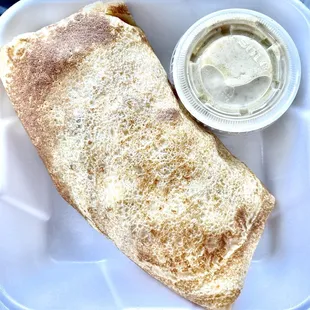 CREPITO CREPE, BACON, CHEDDAR CHEESE, SCRAMBLED EGGS, &amp; COUNTRY POTATOES TOPPED WITH SAUSAGE GRAVY