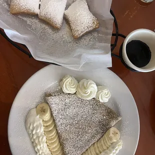 Beignets with chocolate sauce and crêpe