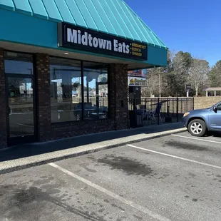 a car parked in front of the restaurant
