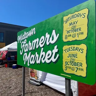 a sign for the farmers market