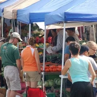 a crowd of people shopping
