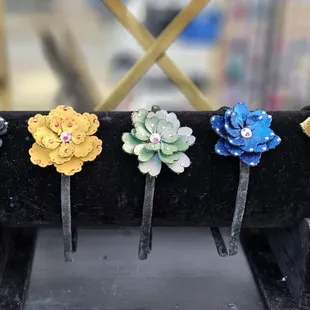 a row of flower pins