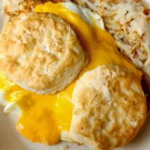 a plate of food with biscuits and eggs