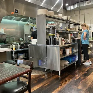 a woman standing in the kitchen