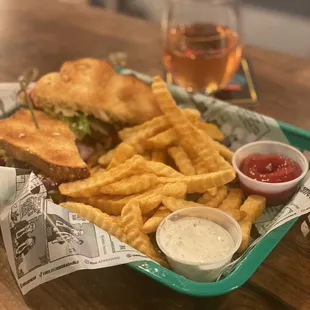 a tray of food including a sandwich and fries