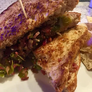 The Rio Hondo Grilled Cheese is light on the cheese but packed full of crispy bacon and spicy green chilies! Hot and delicious!