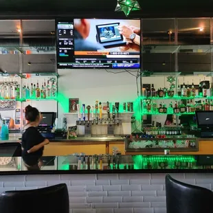 a woman sitting at the bar