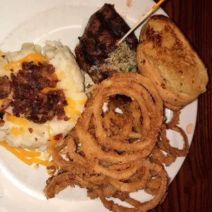 8 ounce filet, onion straws, and loaded mashed potatoes. It was good, but the potatoes were dry.