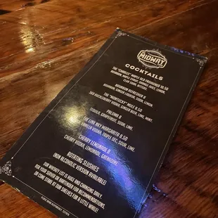 a menu on a wooden table