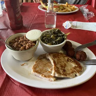 Pork medallions, pintos and turnip greens.