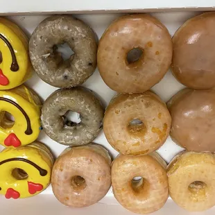Raspberry Jelly Filled, Glazed Doughnuts, Blueberry Cake Doughnuts &amp; Emoji Doughnuts.