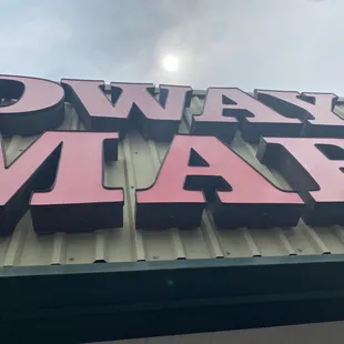 the neon sign for midway market