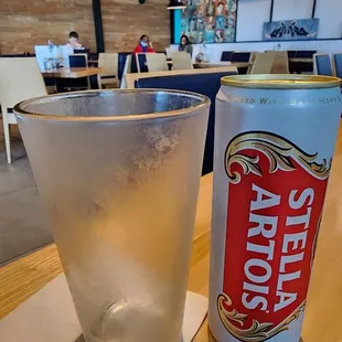 a can of beer and a glass of water