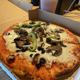 a pizza in a box on a table