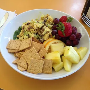 Curry chicken salad with fruit and crackers.