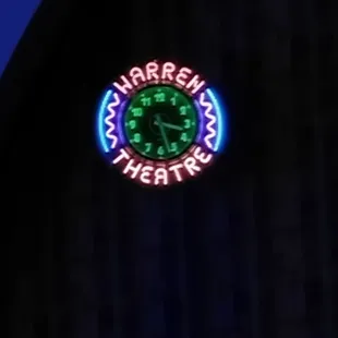 I love they have a neon clock that stays lit inside the theater during the movie! Such a great idea!